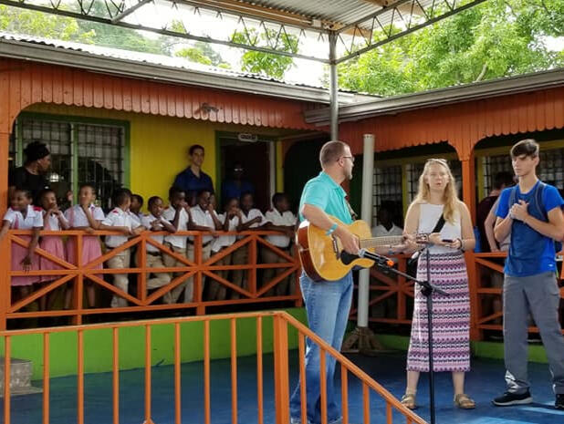 2019 Mission team ministering in song at a local school.